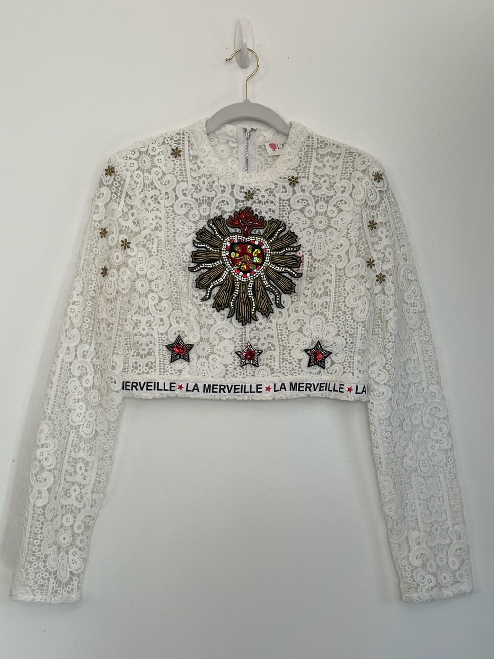 L'ATISTE White Lace Long Sleeve Cropped Top with Embellished Sun and Star Motifs